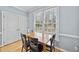 Dining room features hardwood floors, bright windows and neutral paint at 200 Parkbranch Ln, Cary, NC 27519