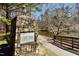 Stone entrance to West Park community with manicured landscape and serene waterside view at 200 Parkbranch Ln, Cary, NC 27519