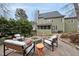 Inviting outdoor space with a cozy fire pit, comfortable seating, and a scenic backyard view at 200 Parkbranch Ln, Cary, NC 27519