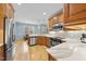 Bright eat-in kitchen with stainless appliances, custom cabinets, hardwood floors and gorgeous light-filled view to back yard at 200 Parkbranch Ln, Cary, NC 27519