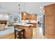 Open floor plan features a kitchen with center island, custom cabinets and stainless appliances adjacent to living room at 200 Parkbranch Ln, Cary, NC 27519