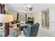 Cozy living room with a comfortable sectional sofa, a ceiling fan, and a mounted television at 200 Parkbranch Ln, Cary, NC 27519