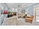Comfortable living room with fireplace, neutral colors, and hardwood floors at 200 Parkbranch Ln, Cary, NC 27519