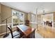 Inviting office featuring a wood desk, neutral walls, and access to the foyer and dining room at 200 Parkbranch Ln, Cary, NC 27519