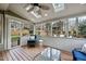 Bright sunroom featuring a cozy wicker chair, skylights, and scenic views of the outdoor landscape at 200 Parkbranch Ln, Cary, NC 27519