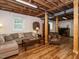 Basement features a lounge area with a sofa, wood accents, and a desk area at 2001 Manuel St, Raleigh, NC 27612