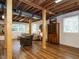 Basement features a lounge area with a sofa and wood accents, with 3 windows providing natural light at 2001 Manuel St, Raleigh, NC 27612