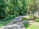 A long, paved driveway leads to the house with a basketball hoop visible near the property at 2001 Manuel St, Raleigh, NC 27612