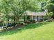 Beautiful home with a well-manicured lawn, professional landscaping, and inviting curb appeal at 2001 Manuel St, Raleigh, NC 27612