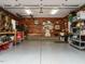 A spacious garage is well-organized with plenty of storage and a rustic wood accent wall at 2001 Manuel St, Raleigh, NC 27612