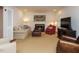Comfortable living room with fireplace, neutral carpet, and plentiful seating at 2001 Manuel St, Raleigh, NC 27612