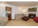 Cozy living room with a fireplace, stylish furnishings, and serene ambiance at 2001 Manuel St, Raleigh, NC 27612