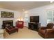 Living room featuring a fireplace, classic decor, and abundant natural light at 2001 Manuel St, Raleigh, NC 27612