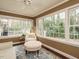 Bright sun room with lots of windows and a neutral color palette at 2001 Manuel St, Raleigh, NC 27612