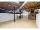 Spacious unfinished basement with exposed beams and utilities, offering ample storage or project space at 203 Lexington Rd, Chapel Hill, NC 27516