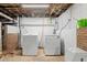 Basement laundry area with washer and dryer, with easy access for chores and storage at 203 Lexington Rd, Chapel Hill, NC 27516