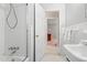 Bright and clean bathroom featuring white tile, a tub, and vanity at 203 Lexington Rd, Chapel Hill, NC 27516