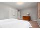 Light and airy bedroom with carpet flooring and a dresser at 203 Lexington Rd, Chapel Hill, NC 27516