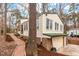 View of home with garage on side and brick walkway at 203 Lexington Rd, Chapel Hill, NC 27516
