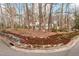 Exterior view of a two-story home, surrounded by trees and landscaping at 203 Lexington Rd, Chapel Hill, NC 27516