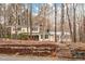 Charming two-story home with a landscaped front yard and stone steps leading to the entrance at 203 Lexington Rd, Chapel Hill, NC 27516