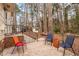 Back patio featuring outdoor seating, steps and view of backyard shed and trees at 203 Lexington Rd, Chapel Hill, NC 27516