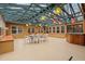 Spacious sunroom with multiple windows, a skylight, and a hot tub at 203 Lexington Rd, Chapel Hill, NC 27516