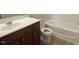 Bathroom features white countertop, toilet, and a shower-tub combination with tiled flooring at 21 Suncrest Ct, Durham, NC 27703