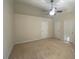 Bedroom with neutral carpet, a ceiling fan, and multiple closet doors, offering ample storage at 21 Suncrest Ct, Durham, NC 27703