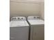 Modern laundry room with updated washer and dryer units for convenient laundry care at 21 Suncrest Ct, Durham, NC 27703