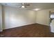 Spacious living room with hardwood floors, ceiling fan, and a neutral color palette awaiting personalization at 21 Suncrest Ct, Durham, NC 27703