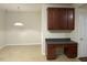 Cozy office space with built-in cabinets, a desk area, and warm lighting for a productive workspace at 21 Suncrest Ct, Durham, NC 27703