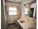 Bathroom featuring tiled countertops, a window with shutters, and pink accents at 2117 George Winston Rd, Oxford, NC 27565