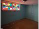 Bedroom with stained-glass window feature casting colorful light into the space at 2117 George Winston Rd, Oxford, NC 27565