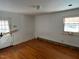 Bedroom featuring hardwood floors, a door to the outside, and white walls at 2117 George Winston Rd, Oxford, NC 27565