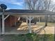 Covered parking area next to a brick house at 2117 George Winston Rd, Oxford, NC 27565