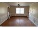Expansive dining room features hardwood floors, trim, and ample natural light at 2117 George Winston Rd, Oxford, NC 27565