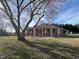 Ranch style brick home featuring a large yard and charming curb appeal at 2117 George Winston Rd, Oxford, NC 27565