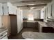 White kitchen featuring spacious counters, ample storage, and a ceiling fan at 2117 George Winston Rd, Oxford, NC 27565