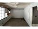 Bright room featuring light-colored paneling, tile flooring, and large windows at 2117 George Winston Rd, Oxford, NC 27565