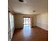 Sun-drenched living room boasts hardwood flooring, traditional trim, and ample space at 2117 George Winston Rd, Oxford, NC 27565