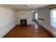 Spacious living room boasts hardwood floors, traditional trim, and a fireplace at 2117 George Winston Rd, Oxford, NC 27565