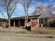 Back exterior of brick home with covered patio and connecting covered parking at 2117 George Winston Rd, Oxford, NC 27565