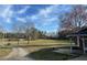 Sprawling lawn with mature trees offering scenic views and ample outdoor space at 2117 George Winston Rd, Oxford, NC 27565
