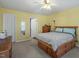 Bright bedroom featuring a ceiling fan, wood furniture, and natural light at 2152 Haig Point Way, Raleigh, NC 27604