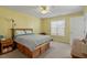 Cozy bedroom with a ceiling fan, natural light, and comfortable furnishings at 2152 Haig Point Way, Raleigh, NC 27604
