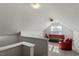 Finished attic space with couch, chair, and ceiling fan at 2152 Haig Point Way, Raleigh, NC 27604