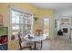 Sun-drenched breakfast nook with a table for two, filled with natural light from the large windows at 2152 Haig Point Way, Raleigh, NC 27604