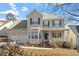 Charming two-story home featuring a covered front porch, bay window, and well-maintained landscaping at 2152 Haig Point Way, Raleigh, NC 27604