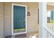 Close-up of the home's front door with a turtle 'Welcome' sign and sidelight windows at 2152 Haig Point Way, Raleigh, NC 27604